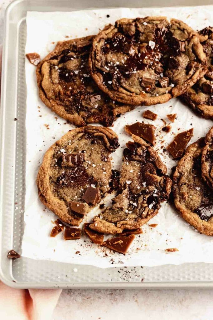 broken in half brown butter toffee cookie on cookie tray