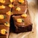 Chocolate cake with frosting and mini pumpkins