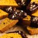pumpkin biscotti covered in chocolate and chopped pecans