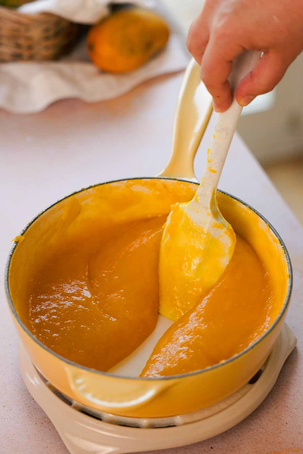 blended mango puree in saucepan