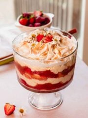 rhubarb trifle layered with custard, rhubarb and fresh strawberry compote, and toasted meringue