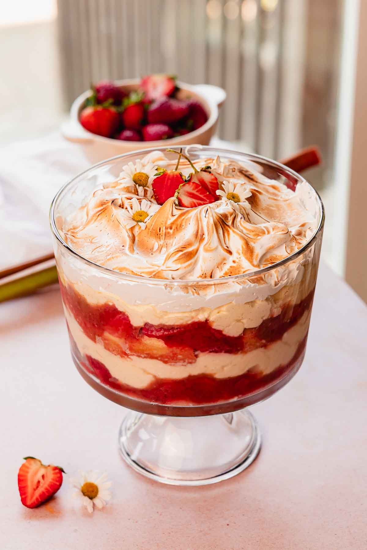 rhubarb trifle layered with custard, rhubarb and fresh strawberry compote, and toasted meringue