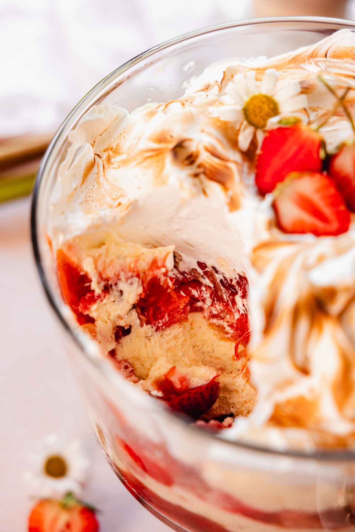 closeup of rhubarb trifle with scoop taken out