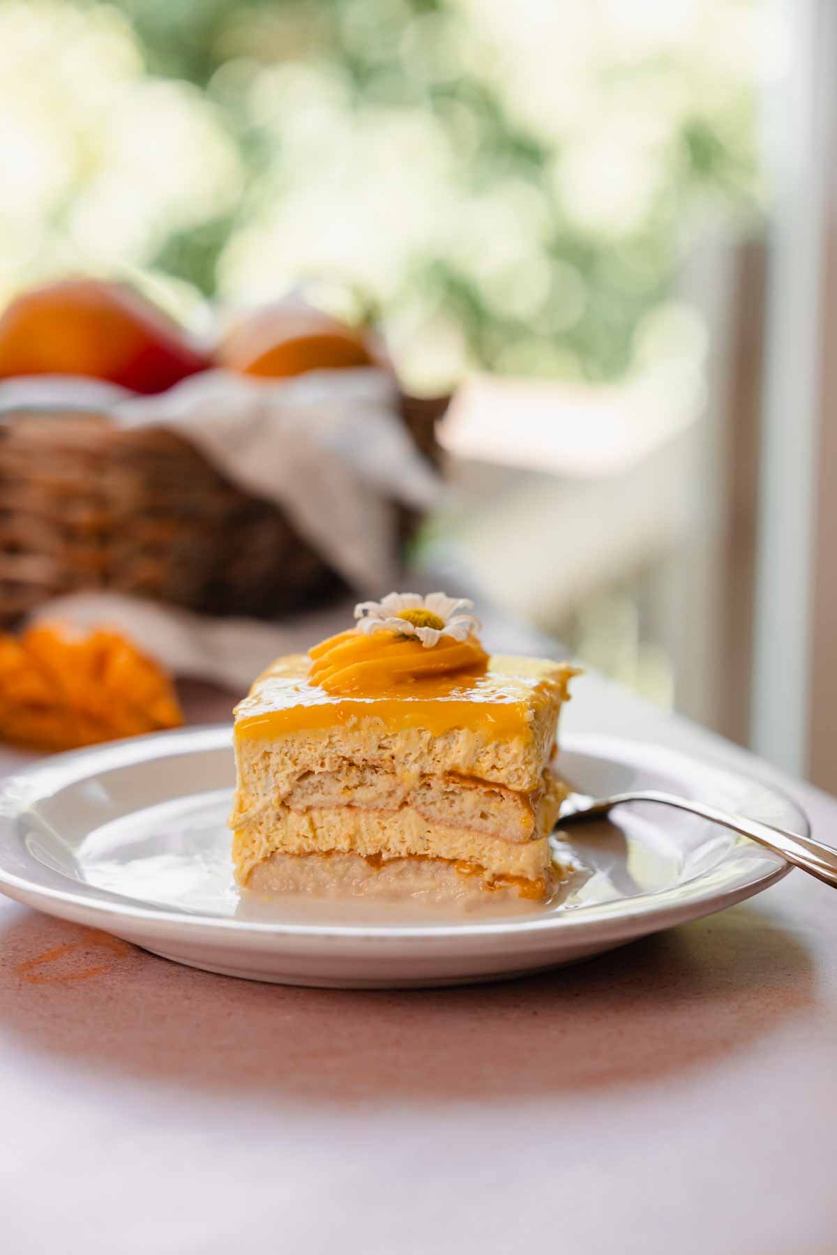 slice of mango tiramisu on a plate