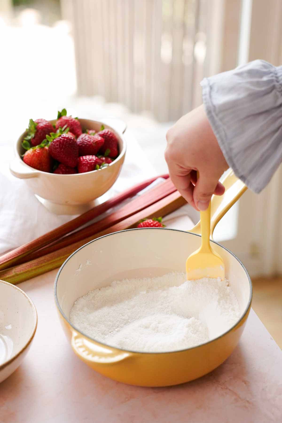 stirring sugar and cornstarch together in saucepan