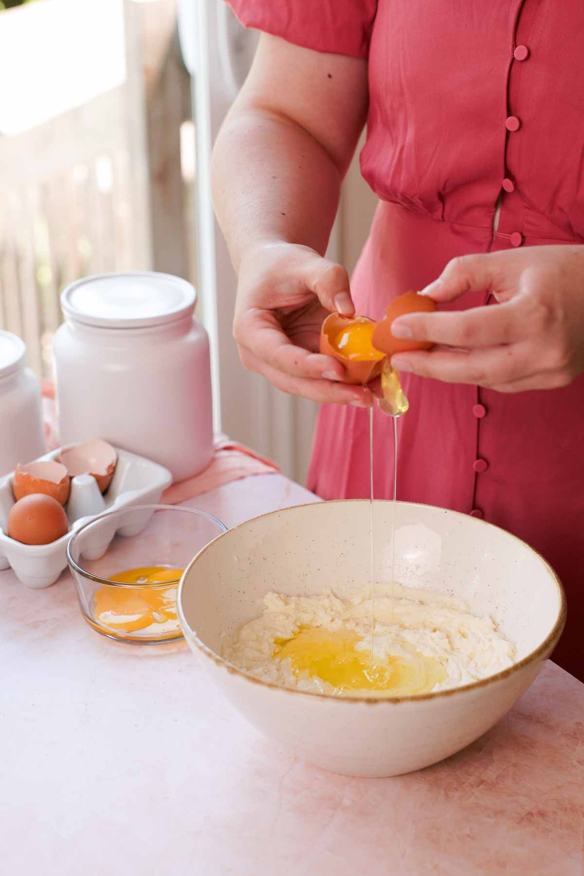 separating egg whites into the coconut cake batter