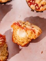 rhubarb muffins with cream cheese filling, rhubarb topping, and crumble