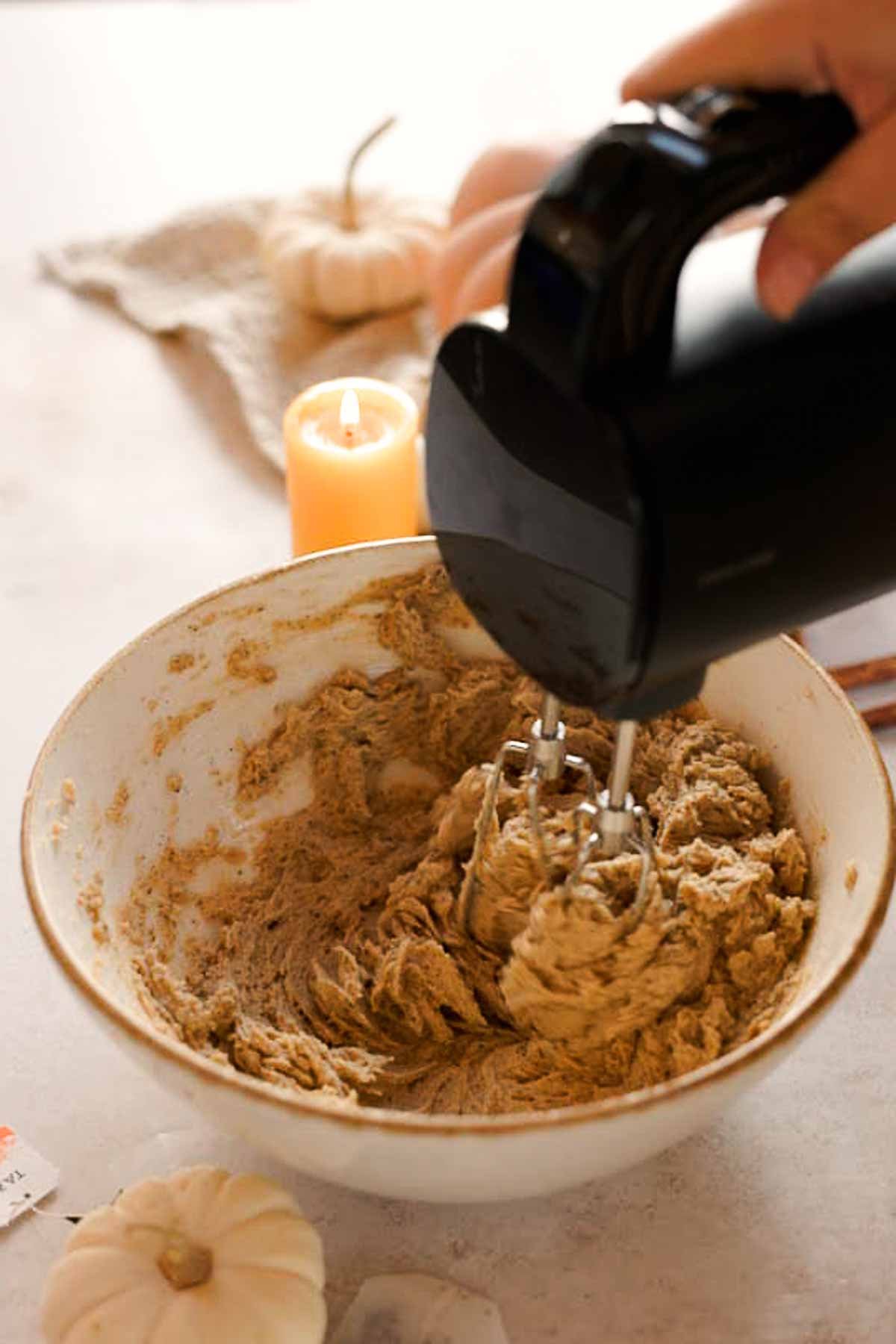 mixing together chai cookie dough wet ingredients with electric mixer