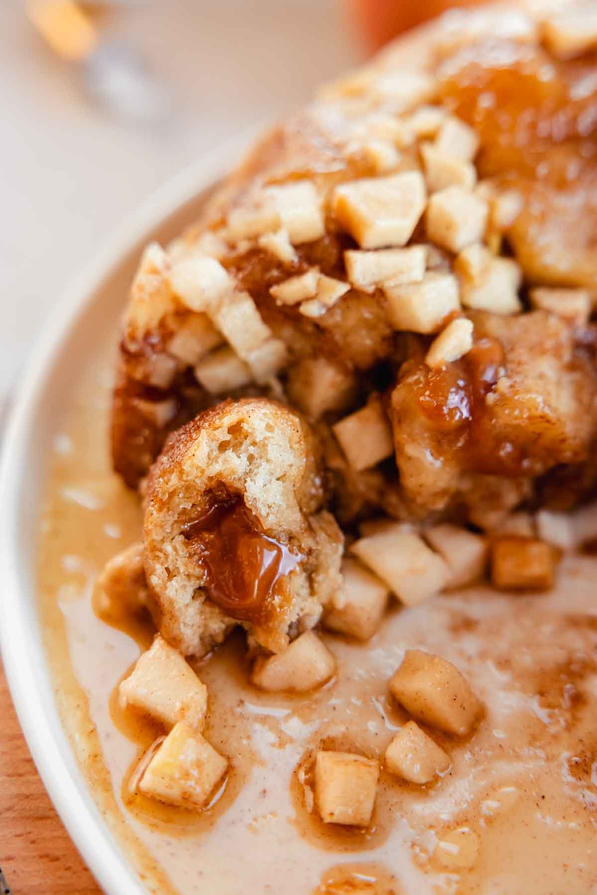 closeup of apple monkey bread ball stuffed with gooey caramel