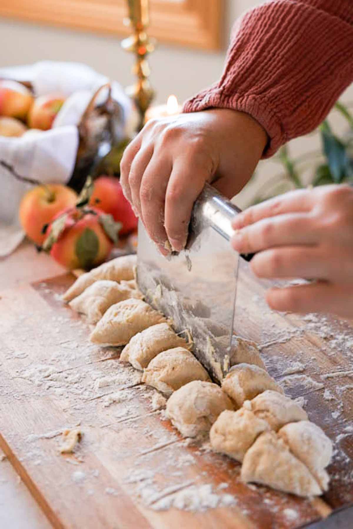 cutting monkey bread dough into small pieces