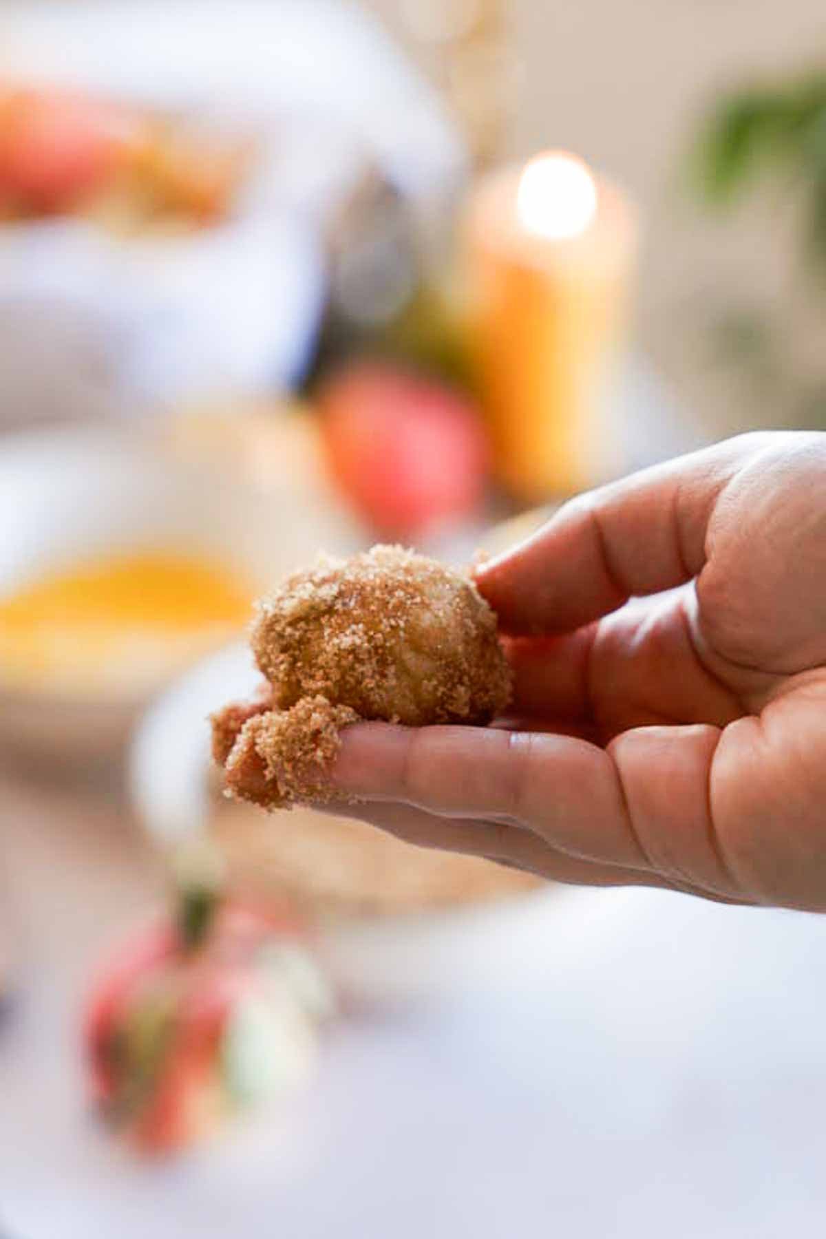 monkey bread dough ball rolled in cinnamon sugar