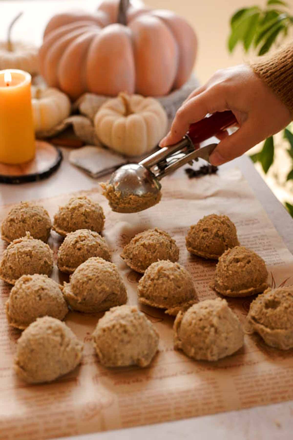 scooping chai cookie dough onto parchment paper