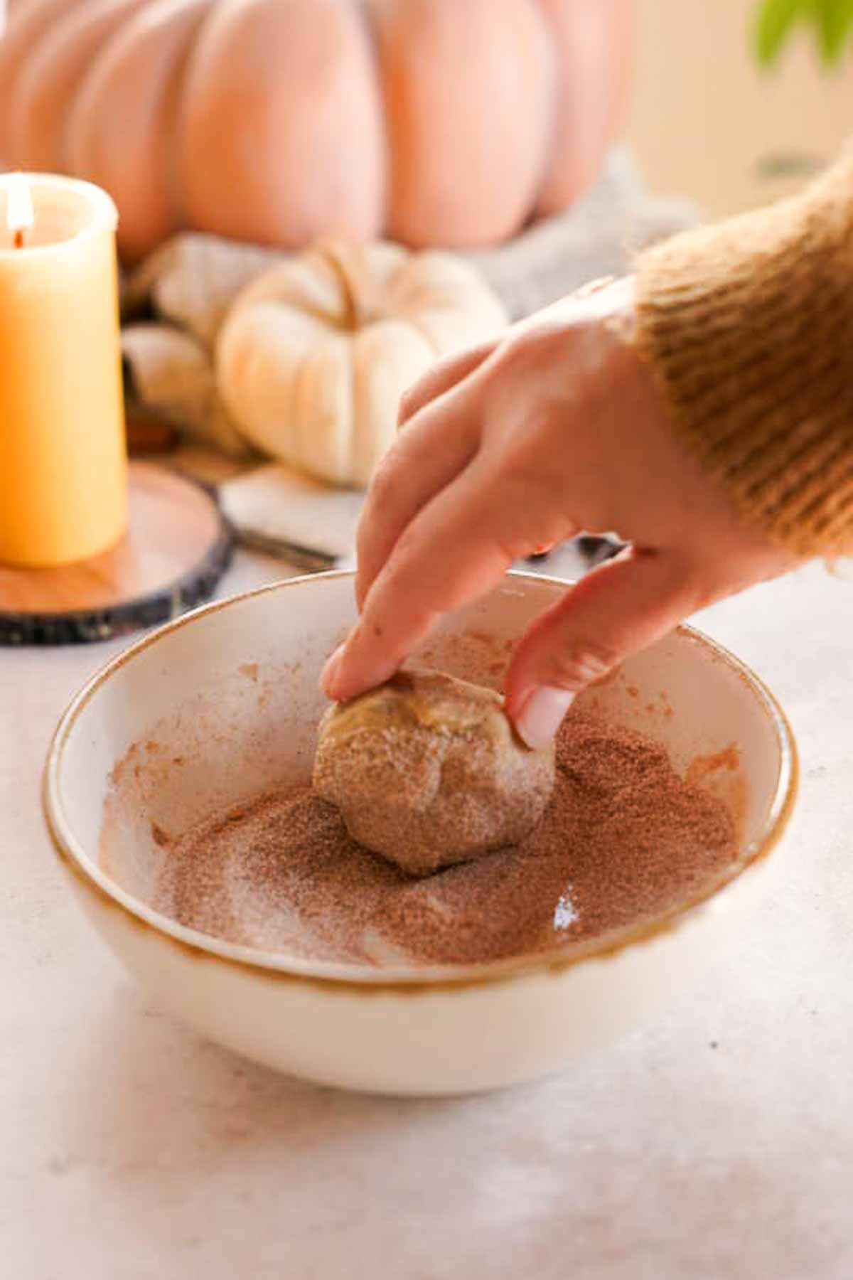 rolling chai cookie dough in spiced sugar