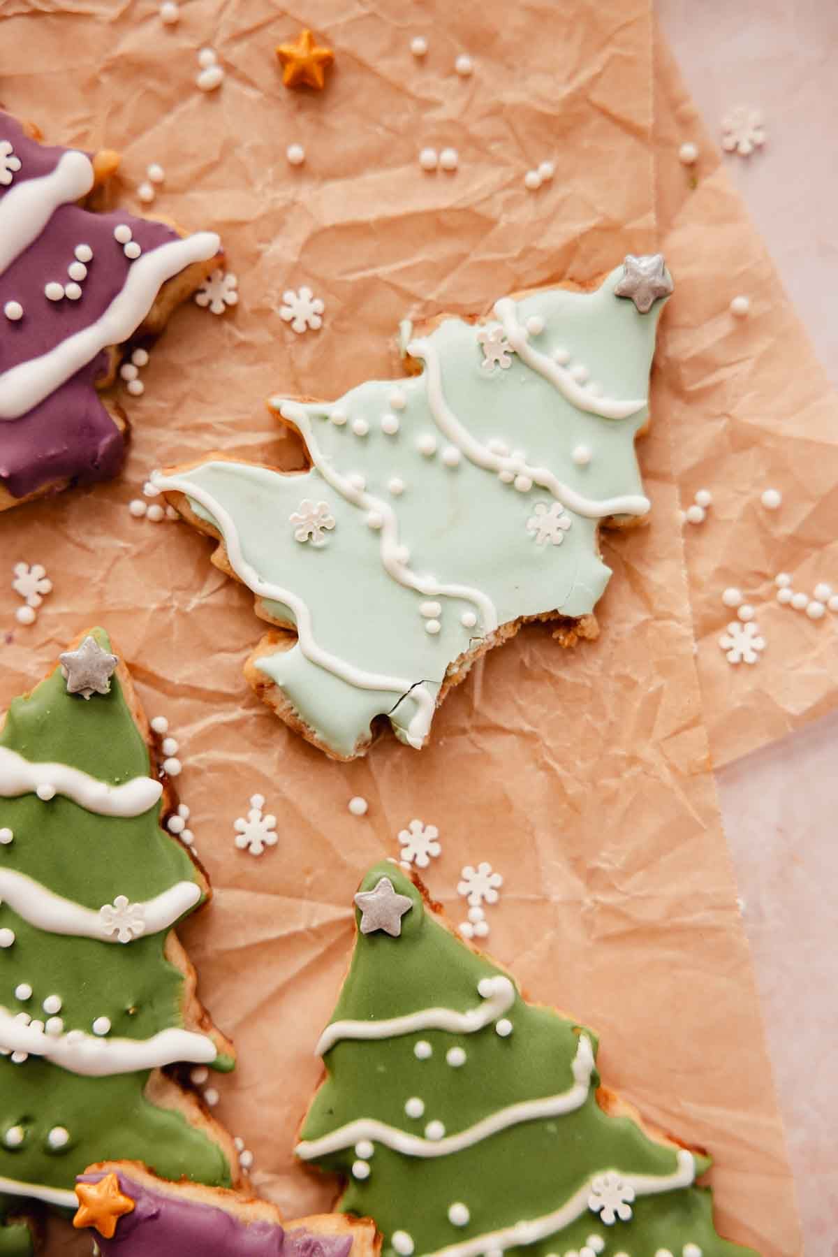 bitten christmas tree sugar cookie decorated with easy royal icing