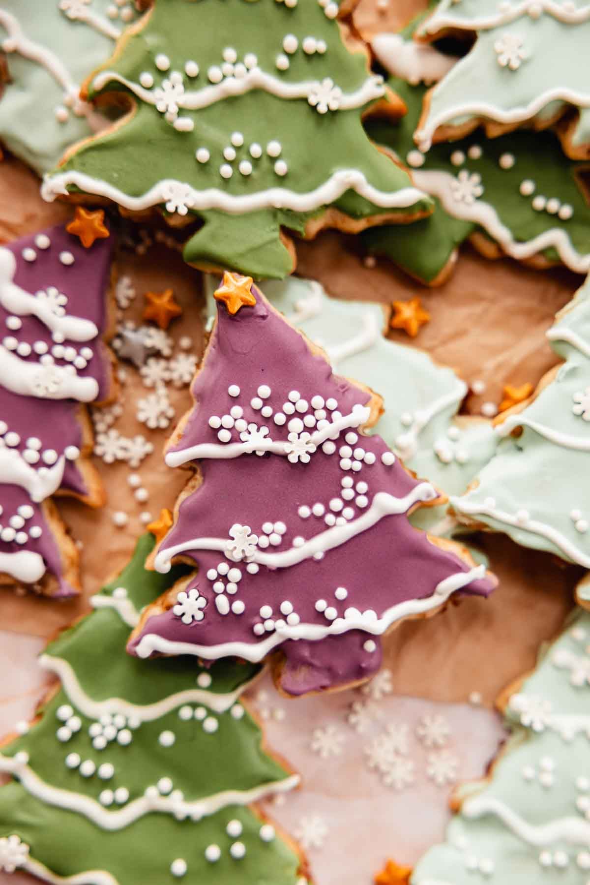 purple and green decorated christmas tree sugar cookies