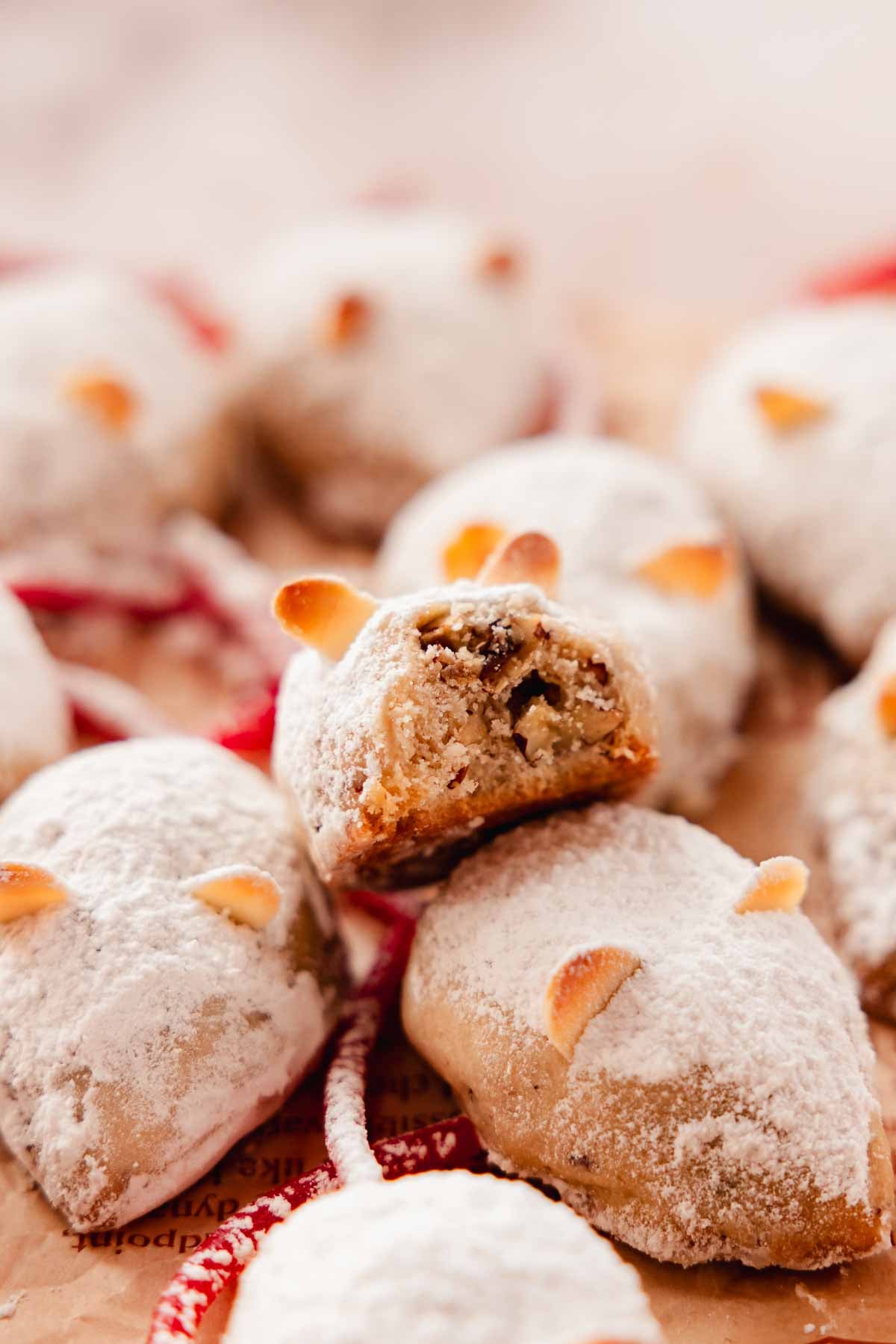 bitten mouse snowball cookie to show sandy, crisp texture