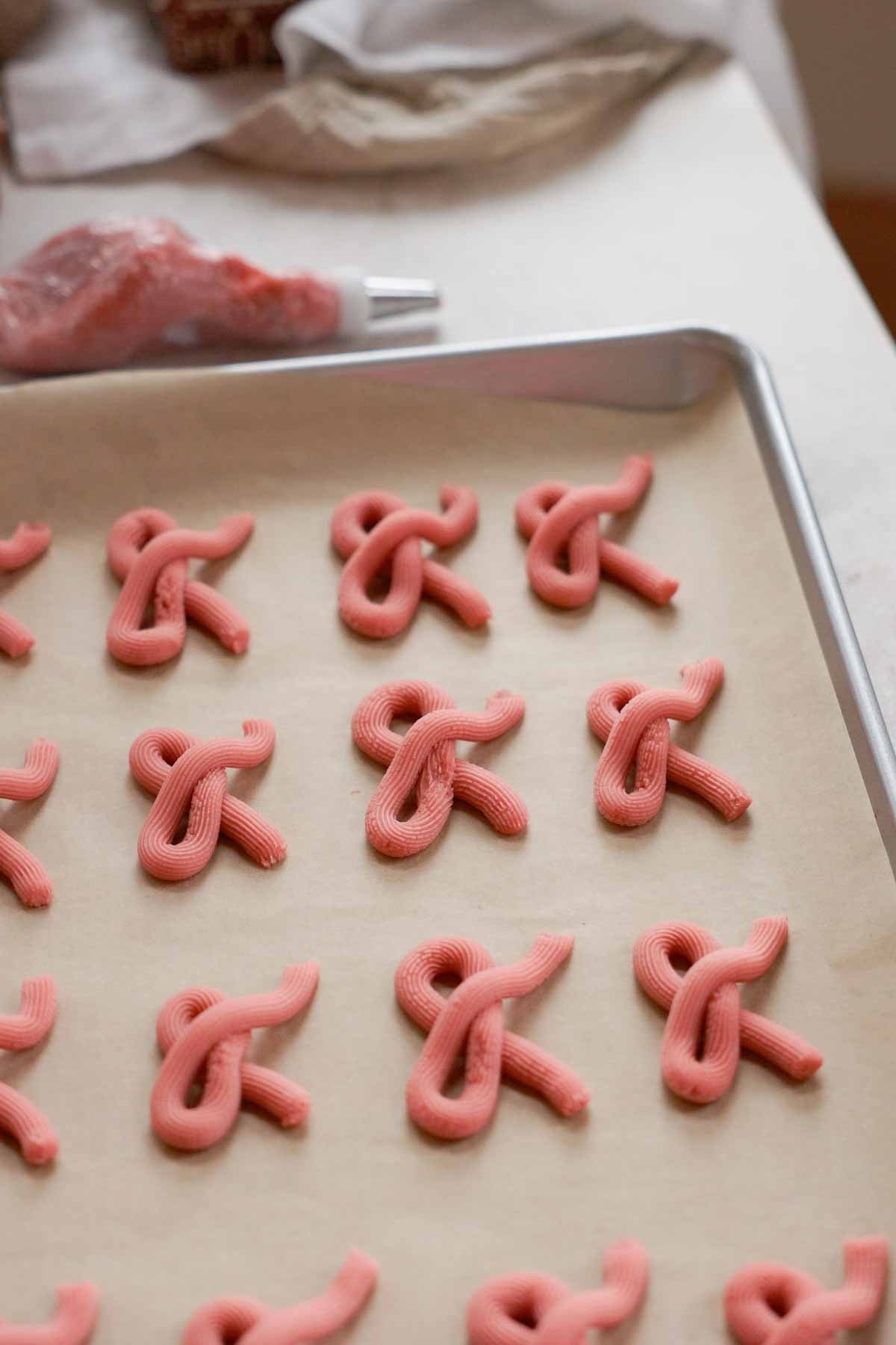 pink cookie dough bows ready to bake