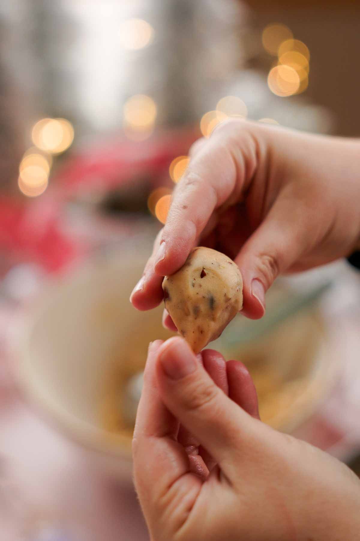 shaping snowball cookie dough into mouse shapes