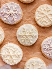 soft snowflake sugar cookies with buttercream and sparkling sugar