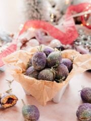 purple and blue sugar coated plum cookies in container