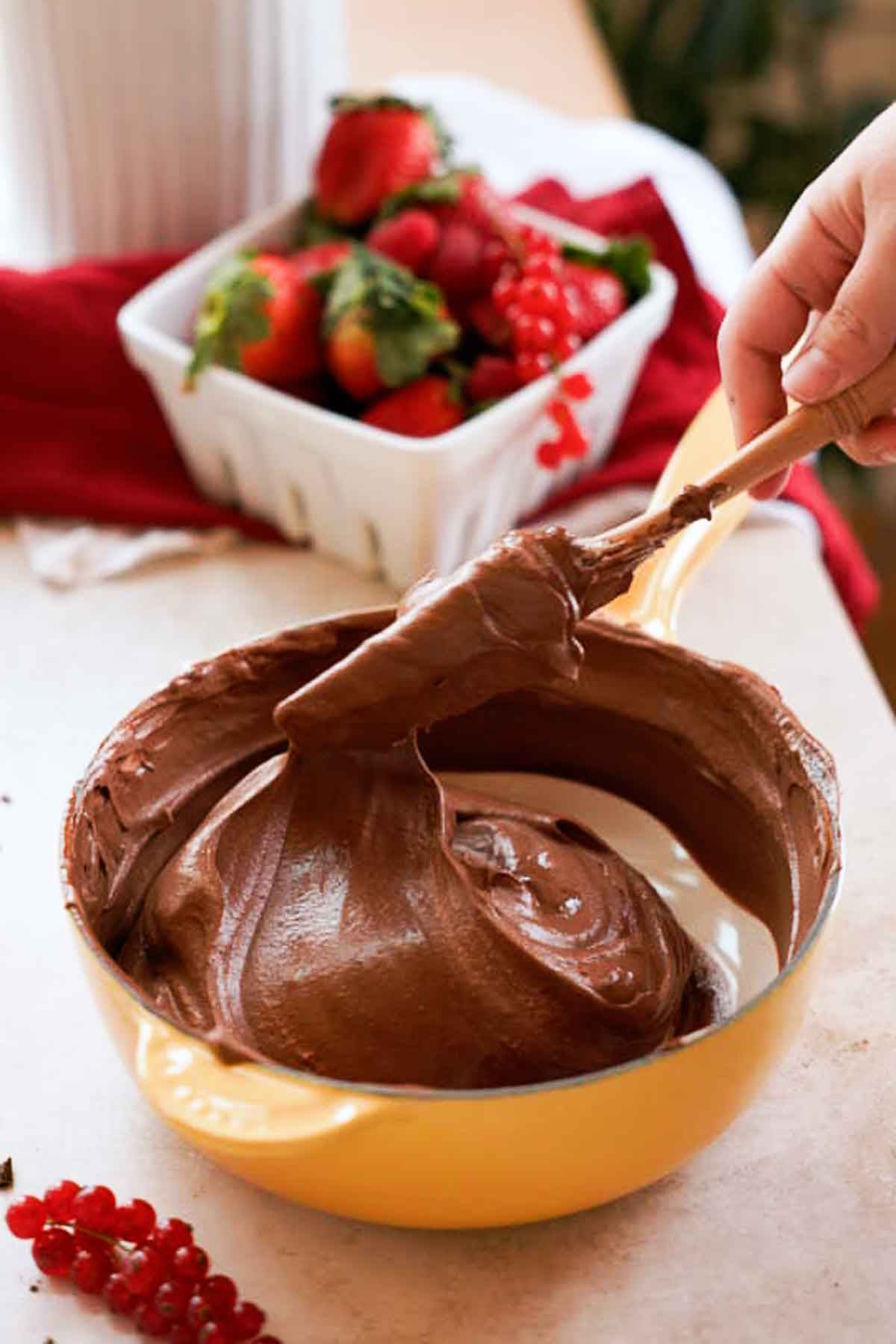 folding whipped cream into chocolate mousse mixture