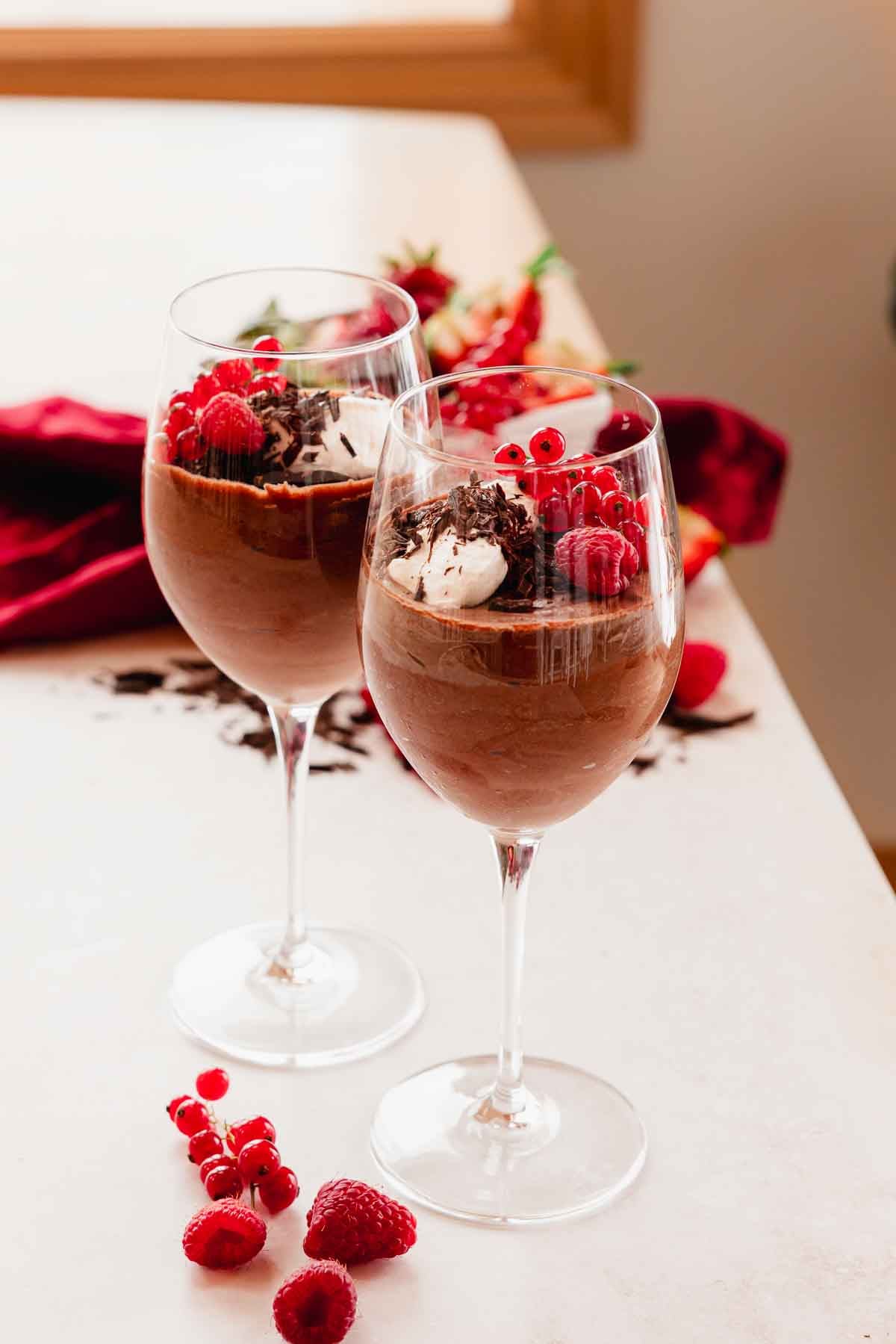 red wine chocolate mousse with berries in wine glasses