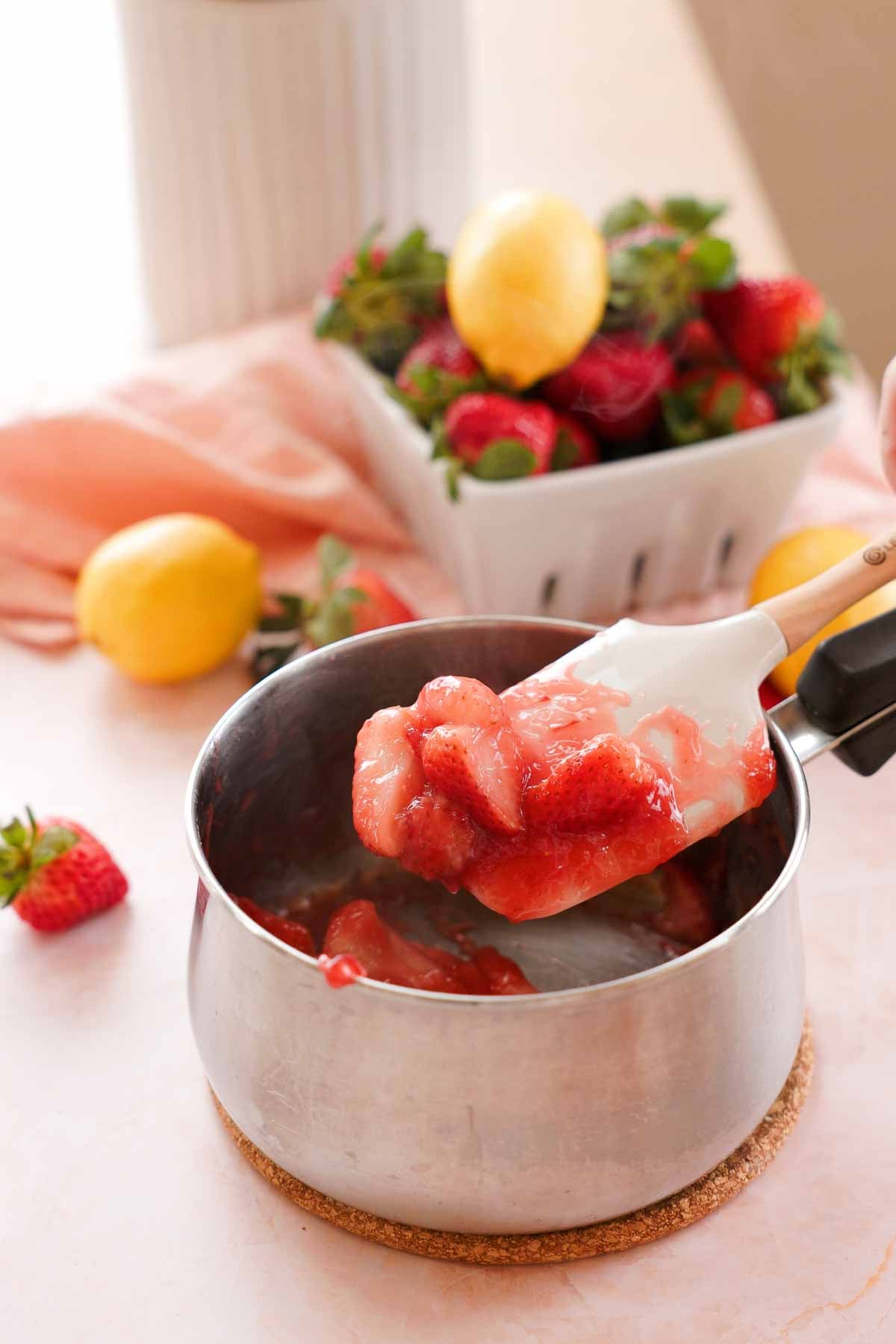 cooking strawberries down in a small saucepan