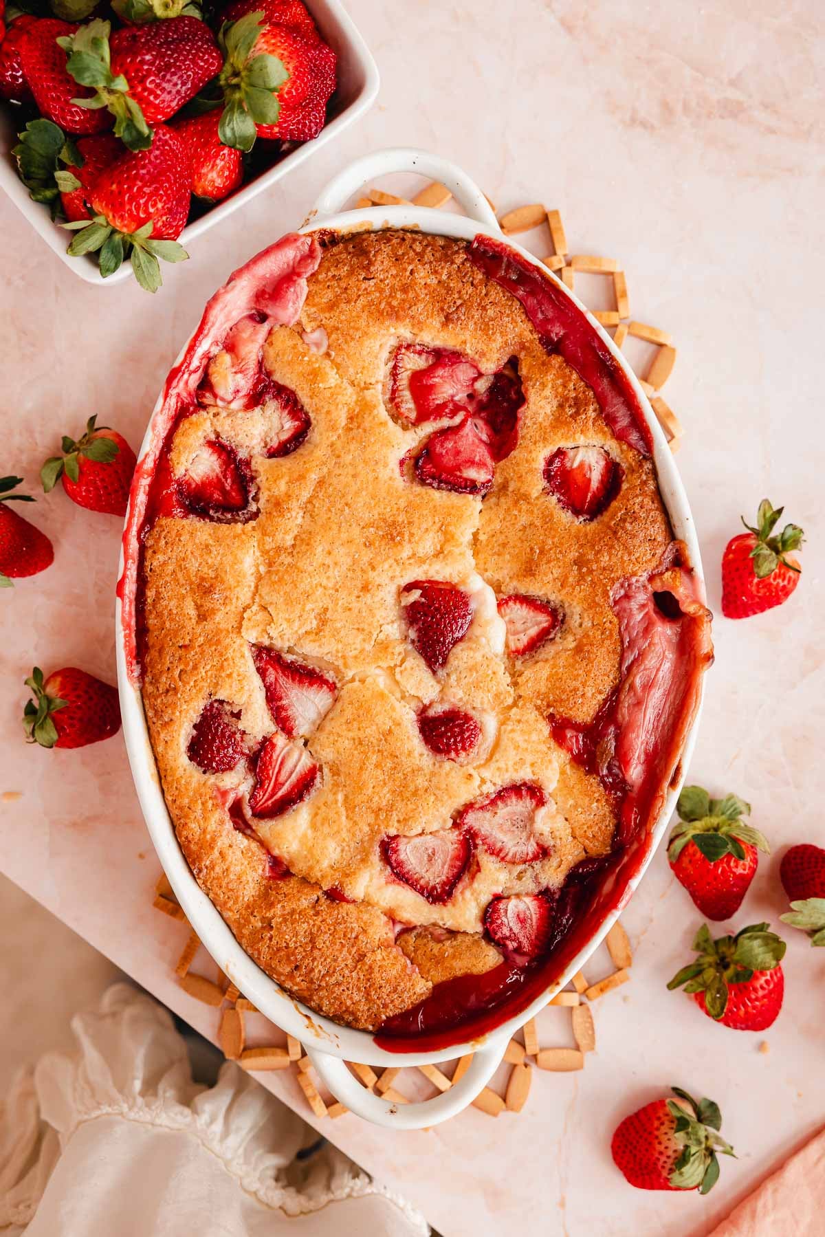 baked strawberry cobbler in oval pan