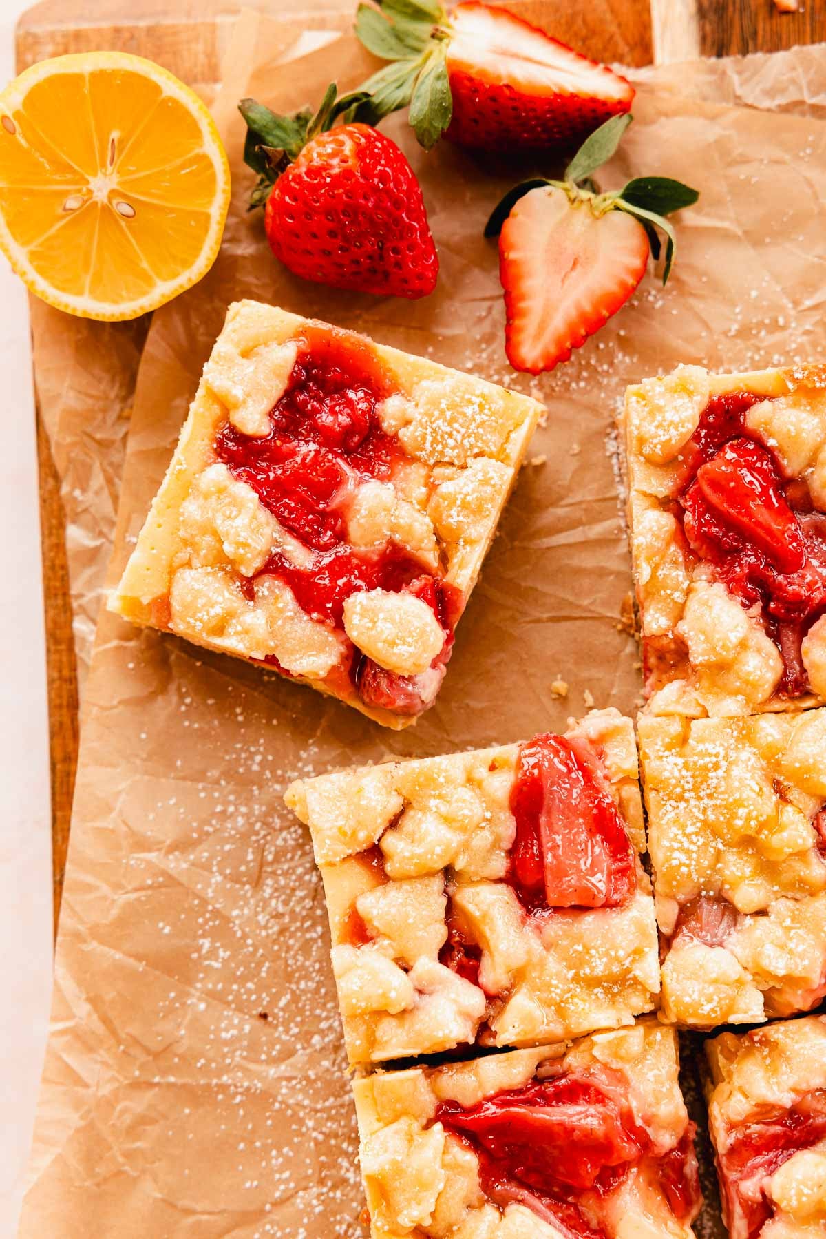 gooey lemon shortbread bars with strawberries and crumble