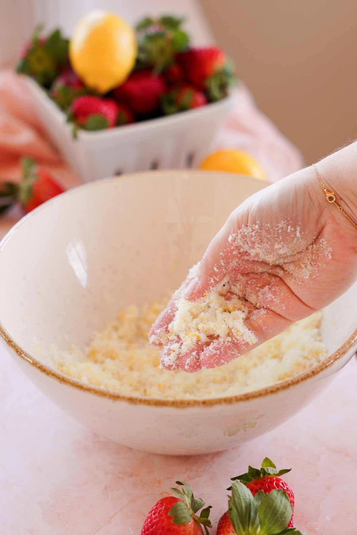 rubbing lemon zest and sugar together in large bowl