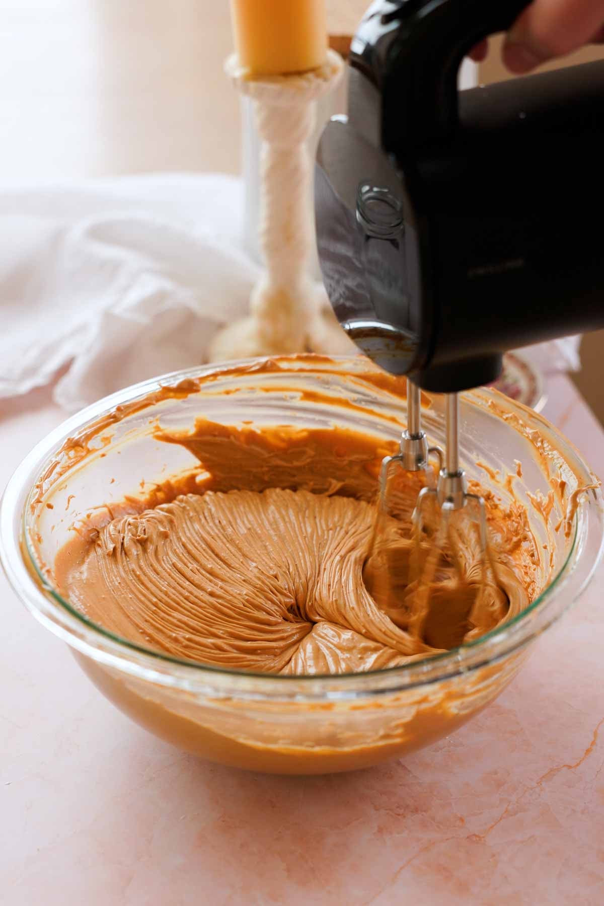 whipped butter and dulce de leche in a large glass bowl