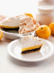 slice of lemon meringue pie with poppy seed filling