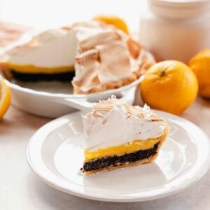 slice of lemon meringue pie with poppy seed filling