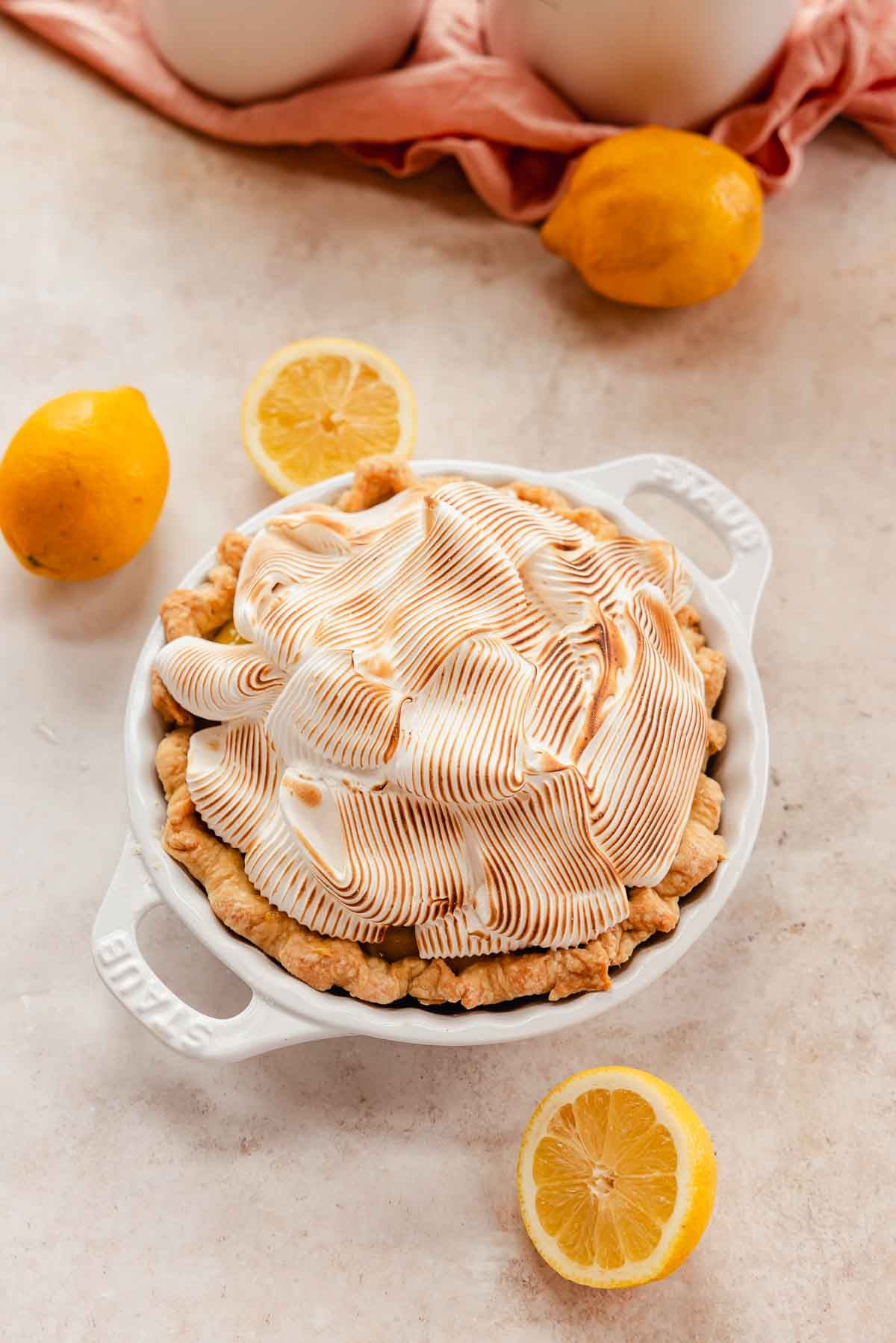 meringue piled high onto a lemon pie