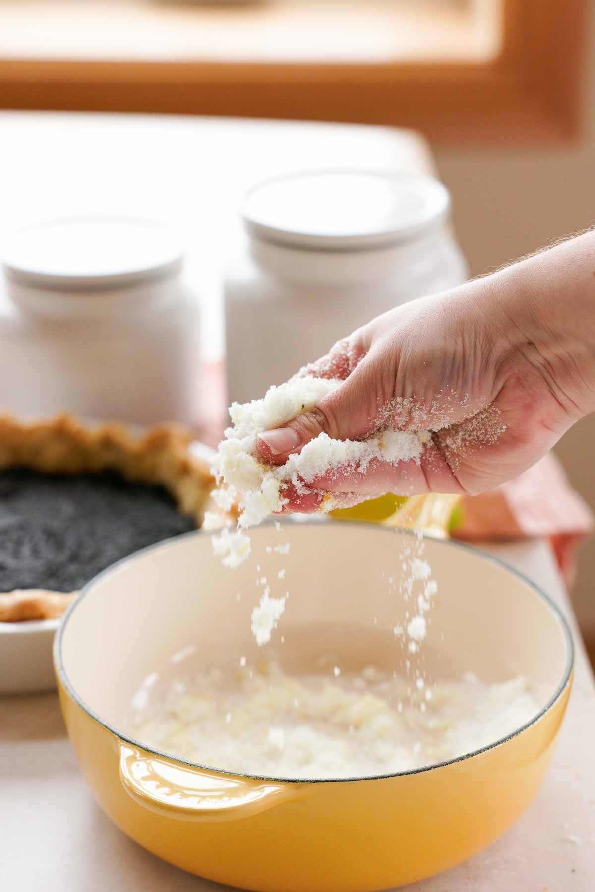 rubbing lemon zest and sugar together with fingers