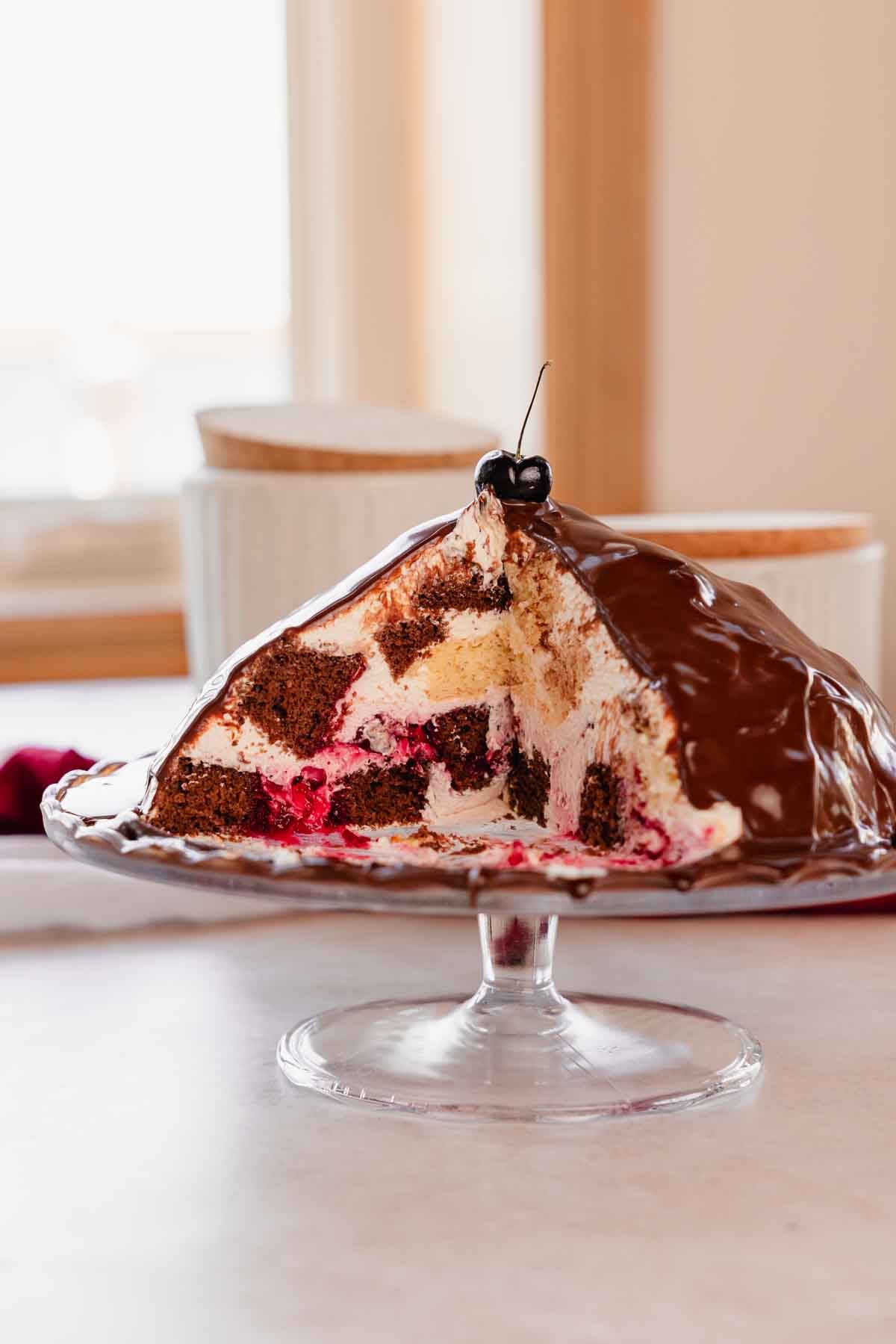 chocolate volcano cake cut to see cross section on cake stand