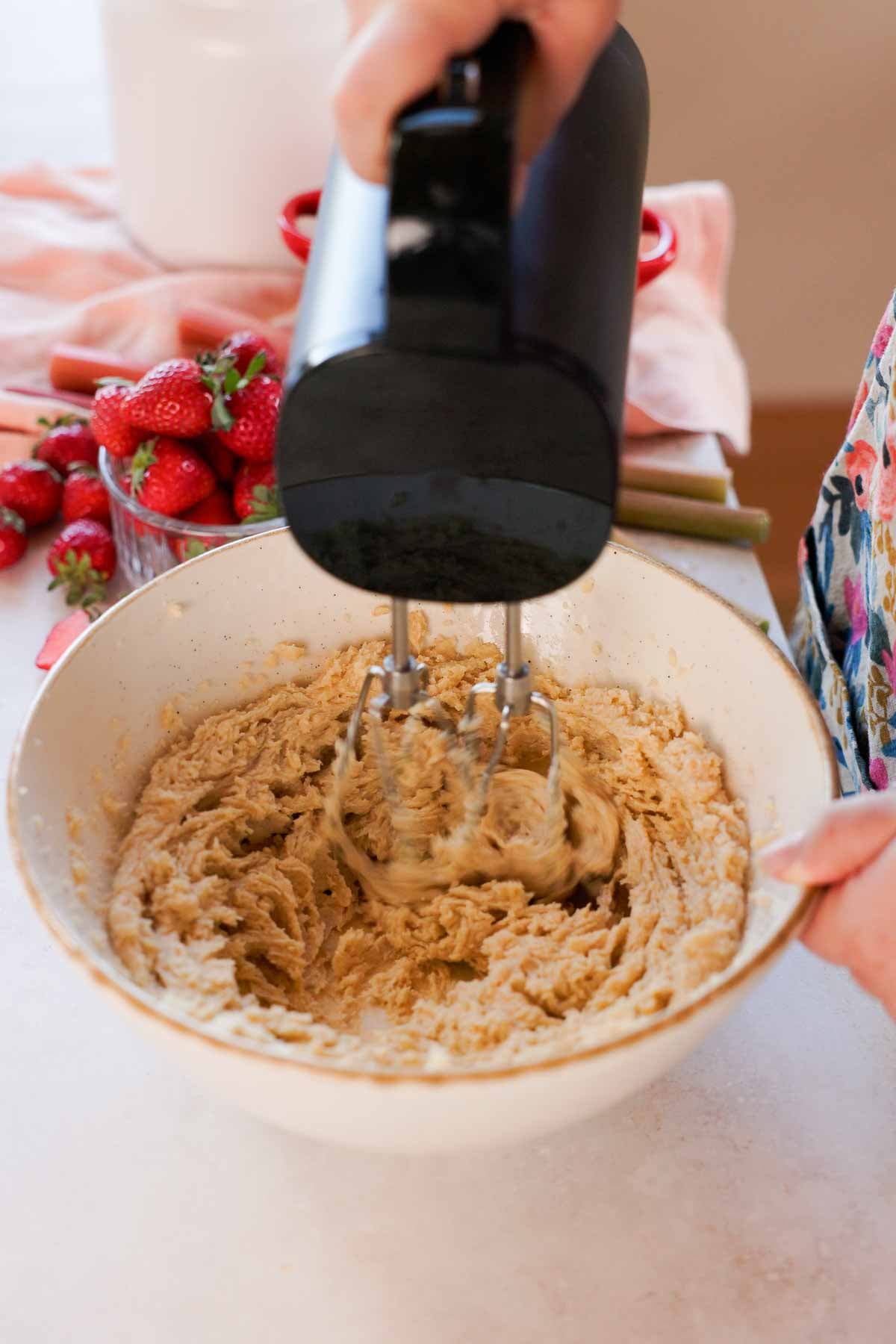 creaming butter, brown sugar, and granulated sugar in a large porcelain bowl with an electric mixer