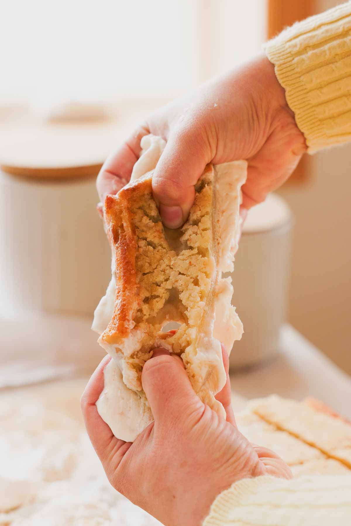 breaking stretchy butter mochi sandwich in half