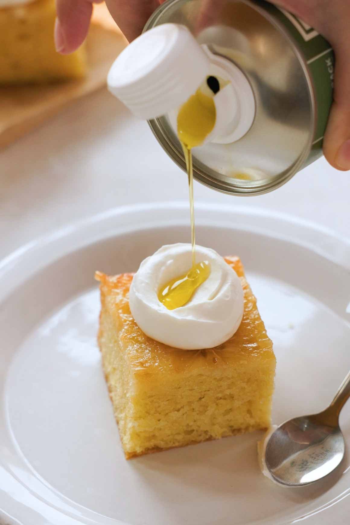 drizzling olive oil onto whipped Greek yogurt cream