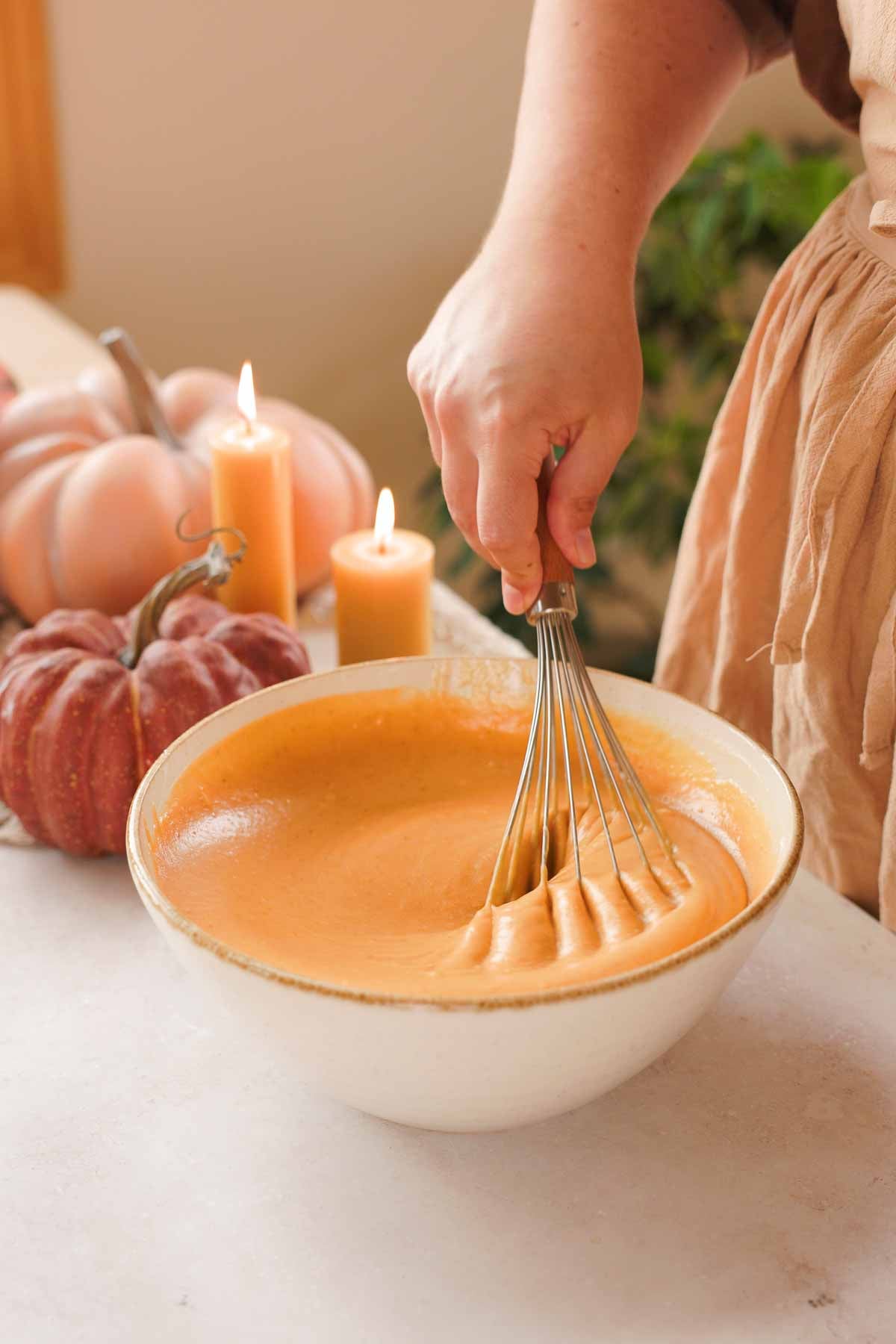whisking chocolate pumpkin cake wet ingredients with whisk