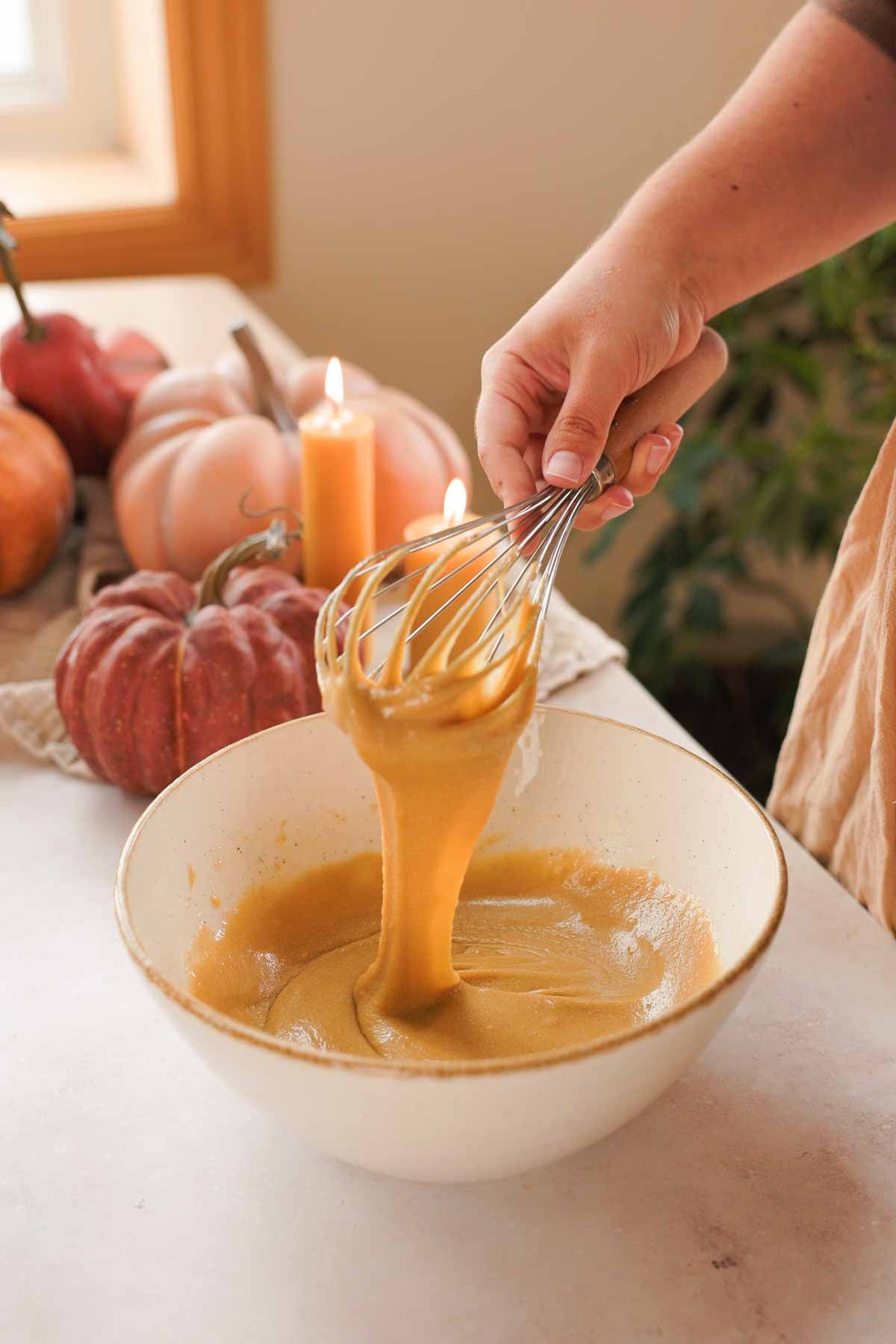 whisked eggs, melted butter, and sugar, falling off whisk in thick ribbons into bowl