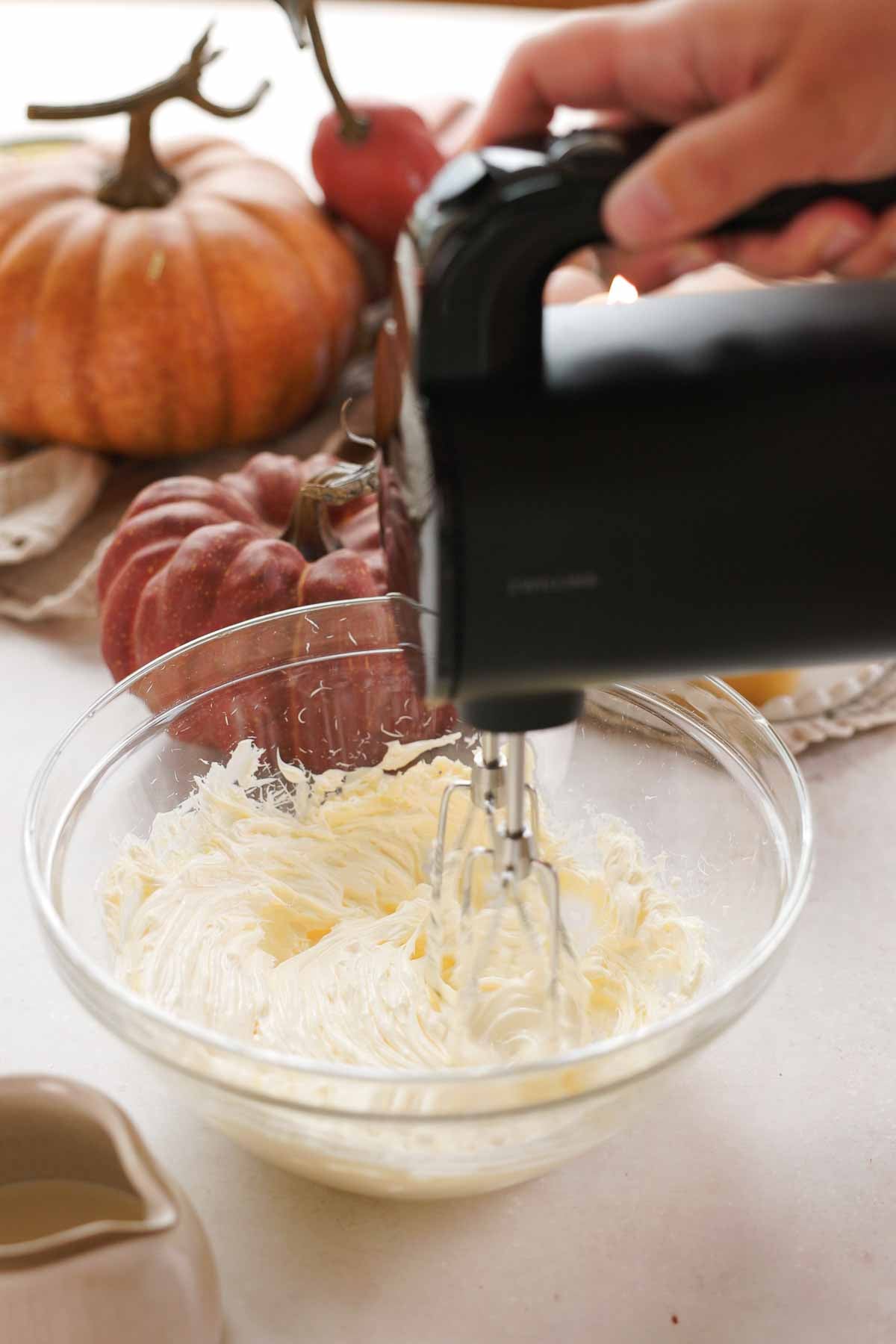 whipping softened butter until light and fluffy in a large glass bowl with an electric mixer